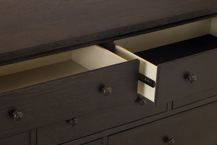 Dark wooden dresser with open drawer